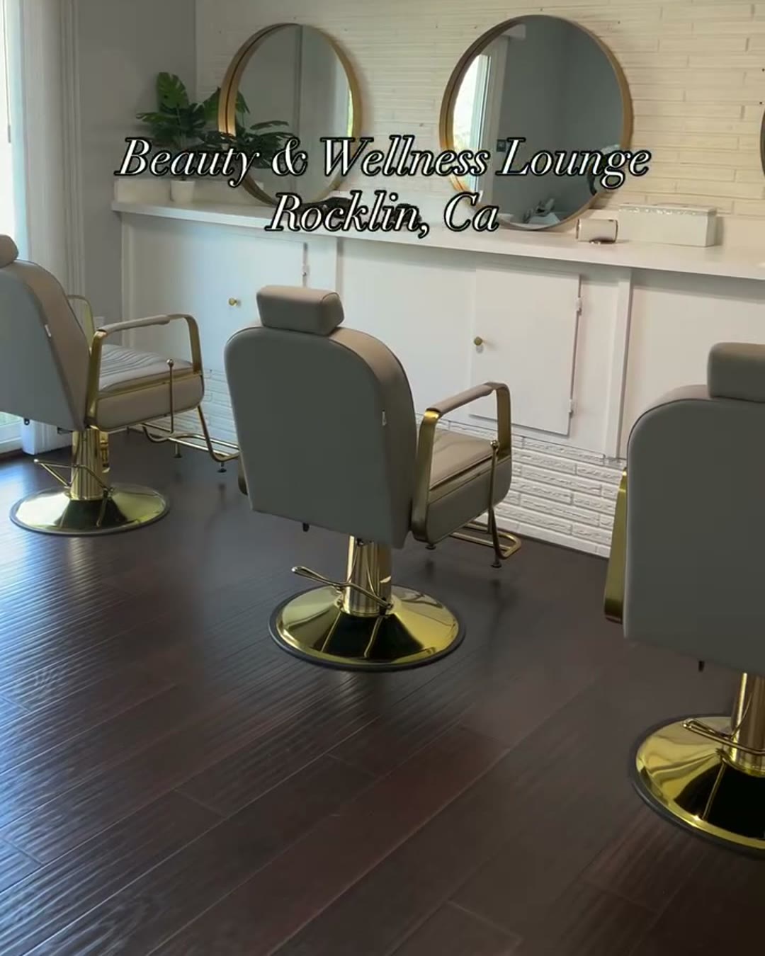 Styling chairs and gold mirrors inside Beauty & Wellness Lounge Co in Rocklin, California